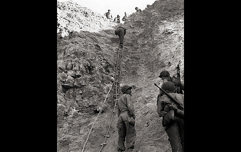 Army Rangers show the rope ladders they used to storm the cliffs at Pointe du Hoc.