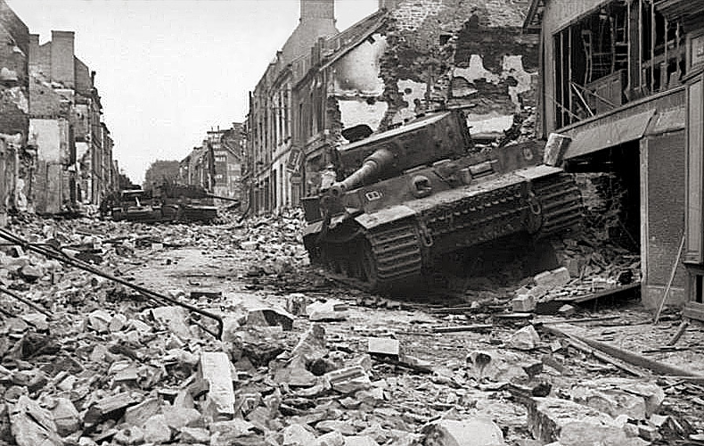 Destroyed German Panzer tanks in the village of Bocage, scene of a major battle with U.S. tanks.