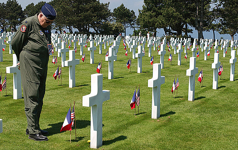 A D-Day veteran of the U.S. Air Force stands at the grave of an Unknown Soldier in the Normandy American Cemetery on the 60th anniversary. 