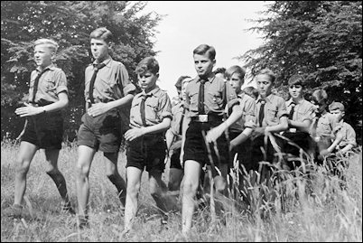 A common scene in the German countryside--Hitler Youths on a brisk military-style hike.