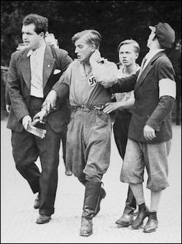 A Nazi youth is wounded during Berlin street violence amid Reichstag elections in 1932. 