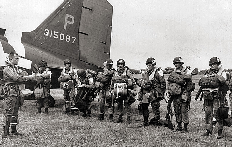 Final instructions for members of the 101st Airborne before boarding their transport plane.