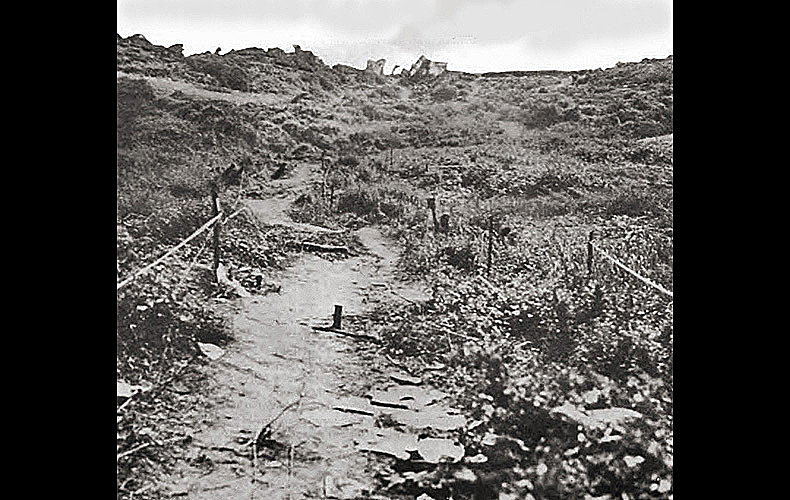 Moving inland from the beaches, invading troops encountered perilous German minefields. This pathway was cleared by combat engineers and used by assaulting troops on D-Day morning.