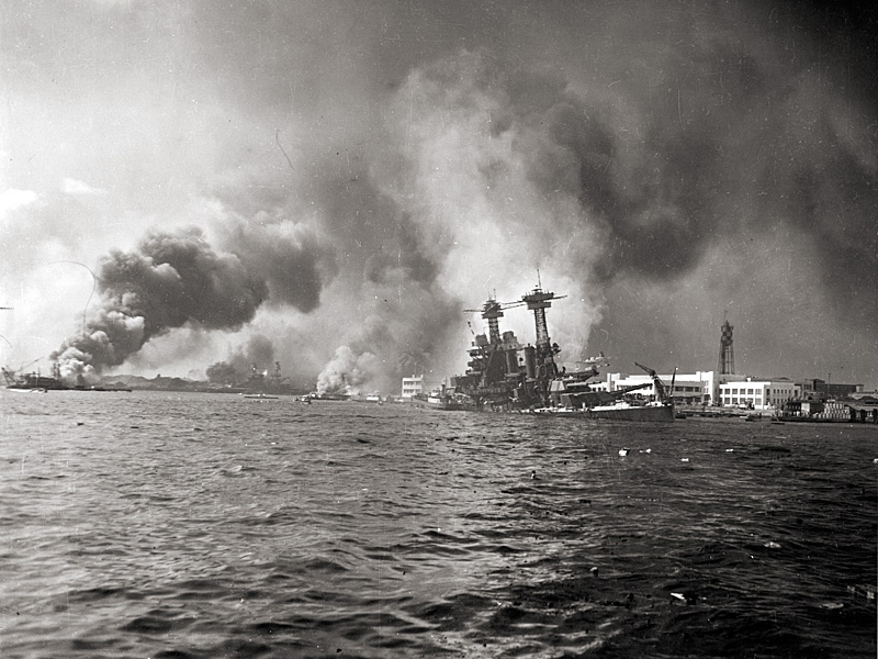 The USS California slowly sinks alongside Ford Island from bomb and torpedo damage. 
