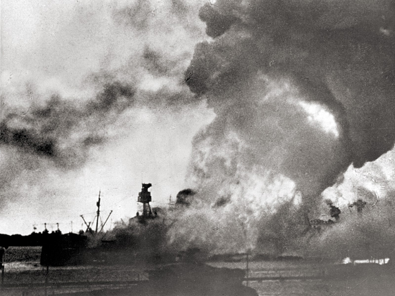 USS Arizona ablaze after her forward ammunition magazines exploded. 