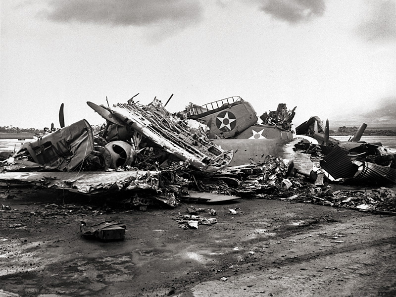 Destroyed U.S. Army aircraft at Wheeler Field, Oahu, during post-attack cleanup activities.