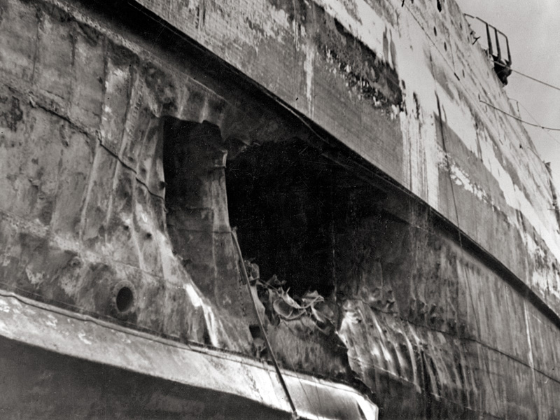 Torpedo damage to the hull of USS California visible after the ship had been drydocked for repairs.