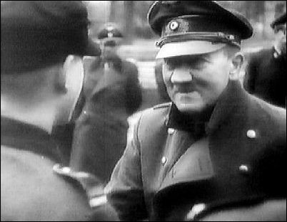 Near the end--April 20th, 1945--the Führer with Hitler Youths outside his Berlin bunker. 